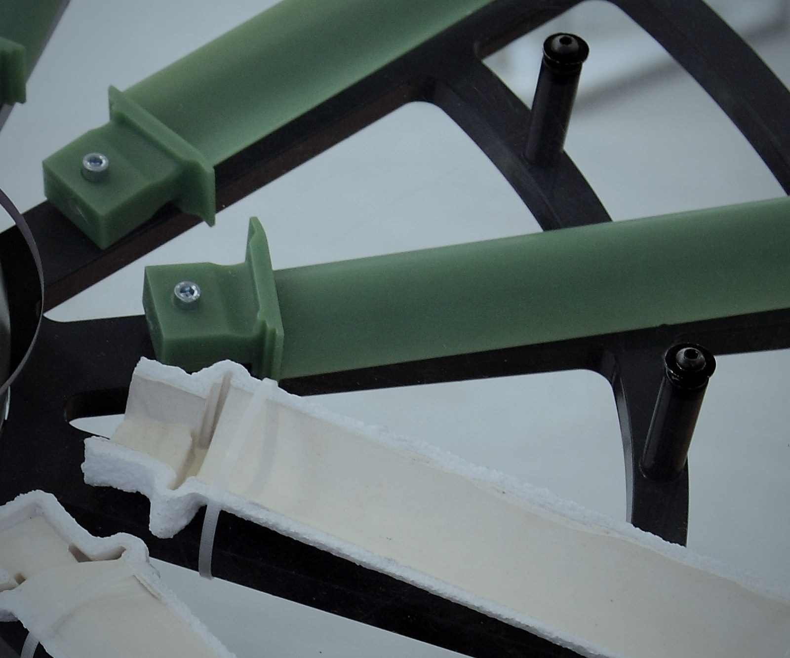 Green runner and sprue wax bars on an assembly fixture